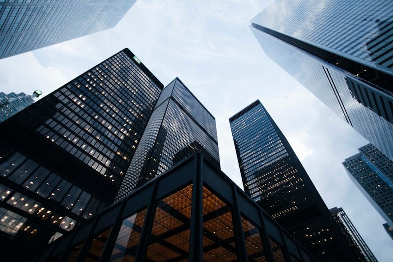 Modern glass office towers viewed from street level