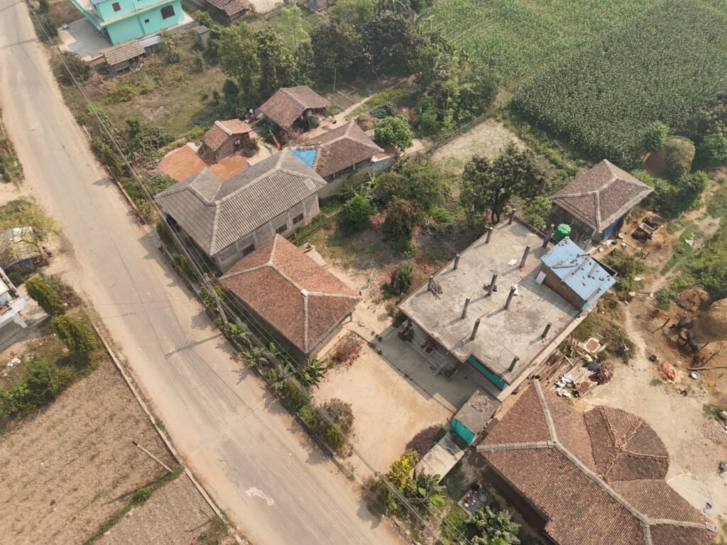Aerial view of rural Nepali village houses — Balen Shah's Building Act 2083 bill guarantees housing for every Nepali citizen