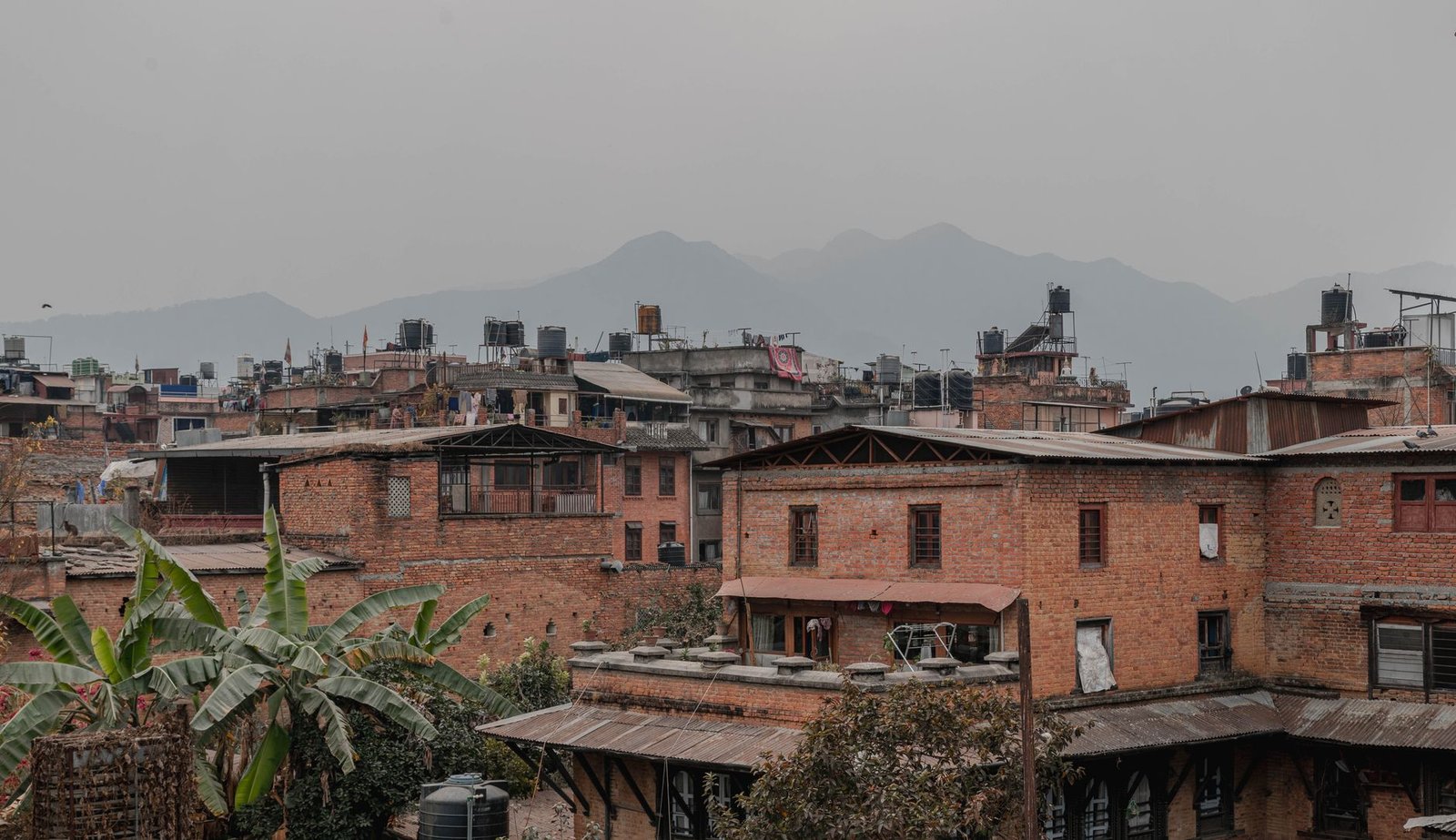 Rustic brick residential buildings in Kathmandu, Nepal — Building Act 2083 Nepal housing bill