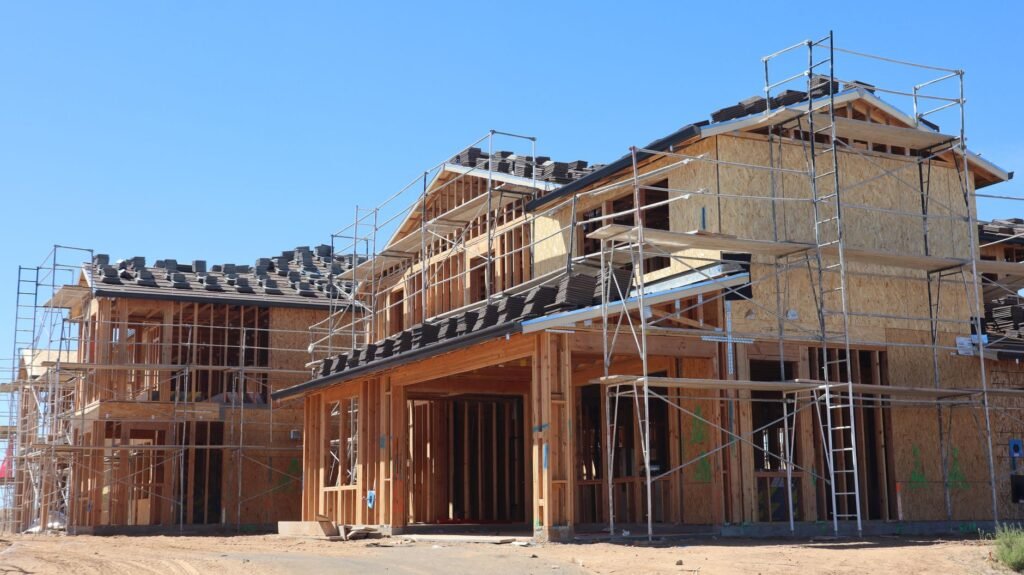 Kalika Homes controversy: house construction site in Nepal with scaffolding during home building